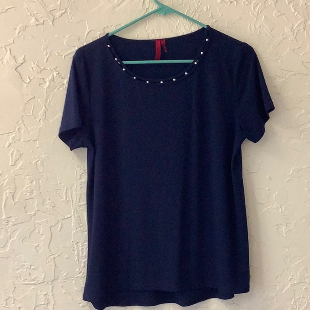 Navy blue ornate scoop necked top with short sleeves.